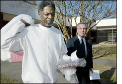 Jerry Hills walks out of the parish jail a free man. 
